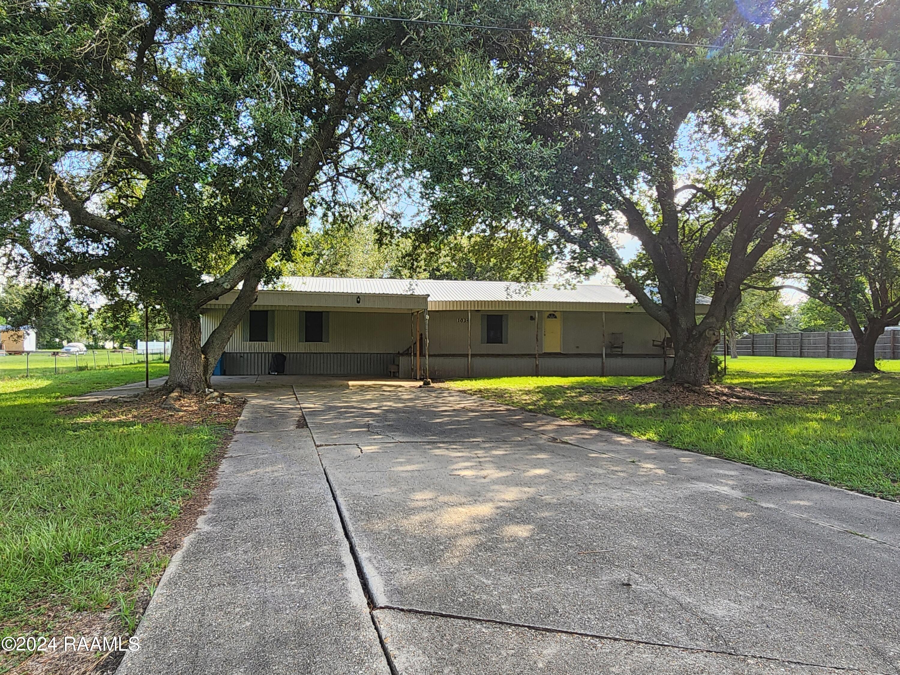 1034 Leger Road Breaux Bridge, LA 70517 - Photo 1 of 39 front w/double carport