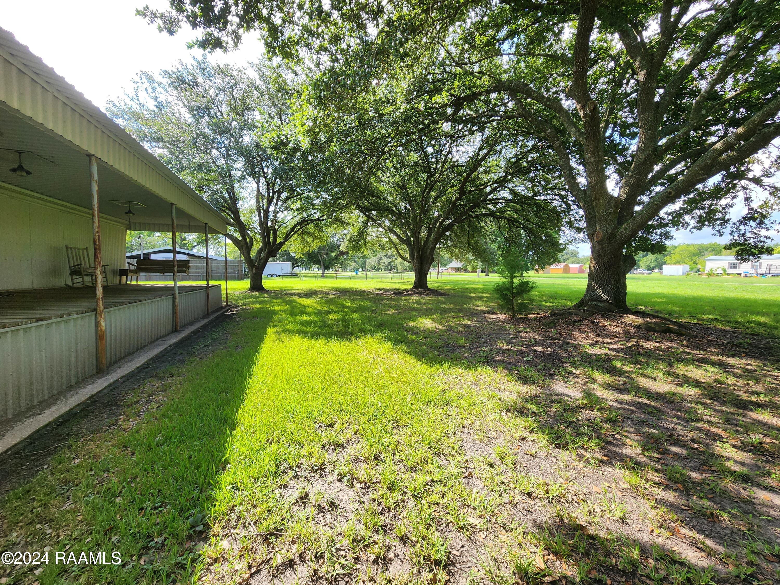 1034 Leger Road Breaux Bridge, LA 70517 - Photo 38 of 39 covered front porch