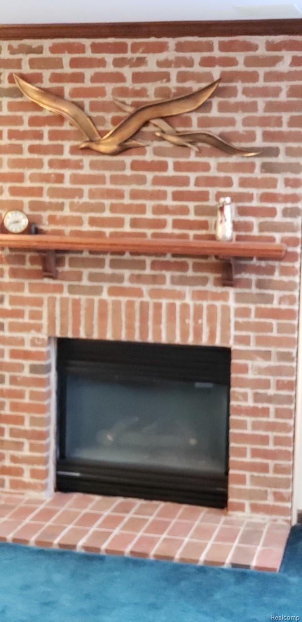 7785 Lee Road Brighton, MI 48116 - Photo 12 of 19 Lower level fireplace
