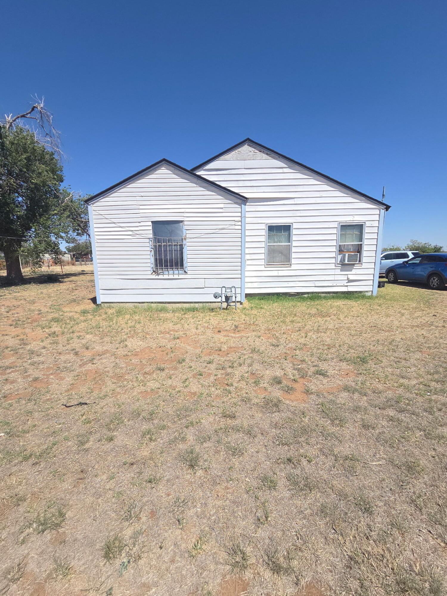 4215 East 65th Street Lubbock, TX 79403 - Photo 2 of 5 a house that has a big yard