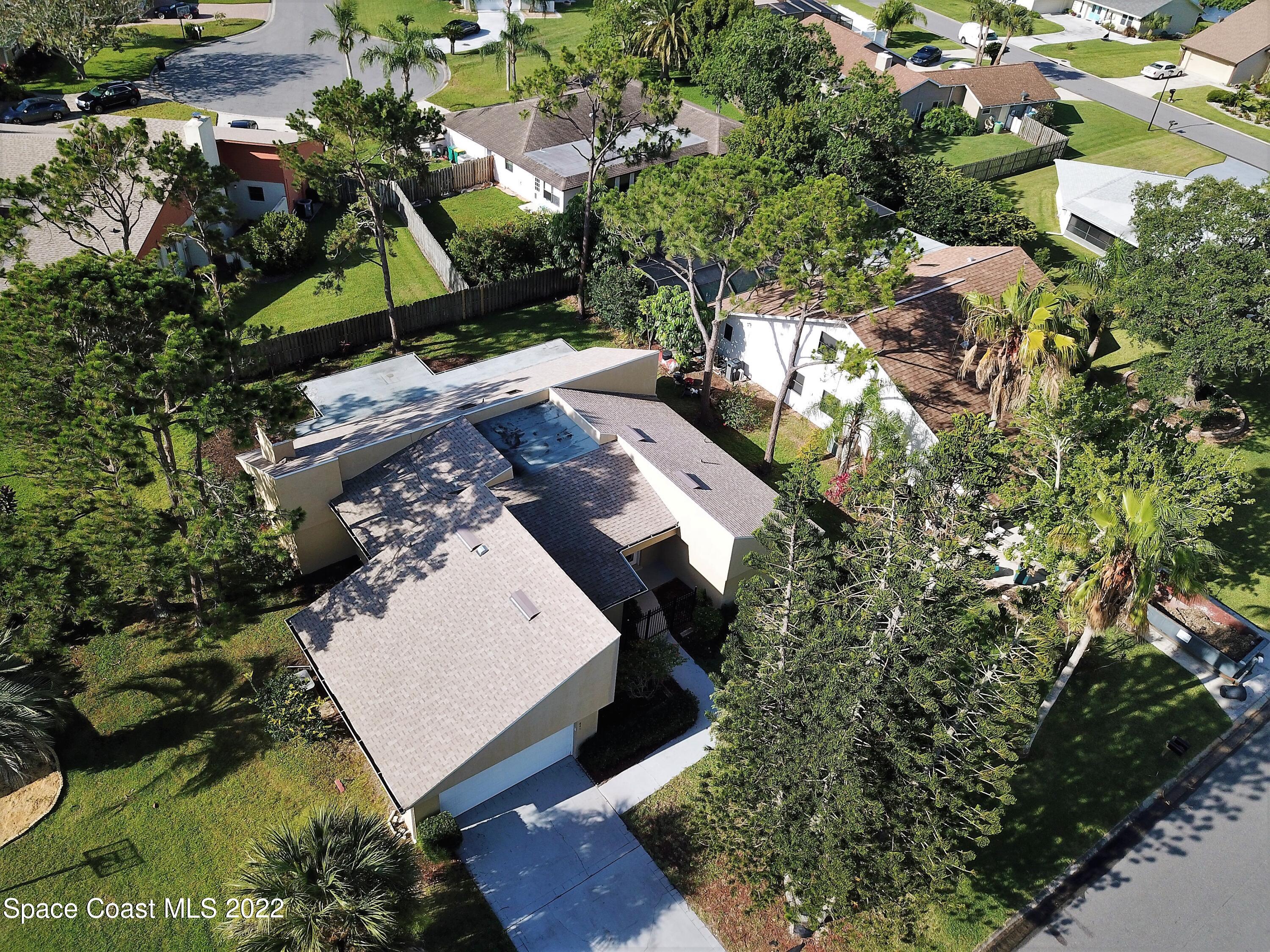841 Preston Trail Melbourne, FL 32940 - Photo 2 of 20 an aerial view of a house with a yard