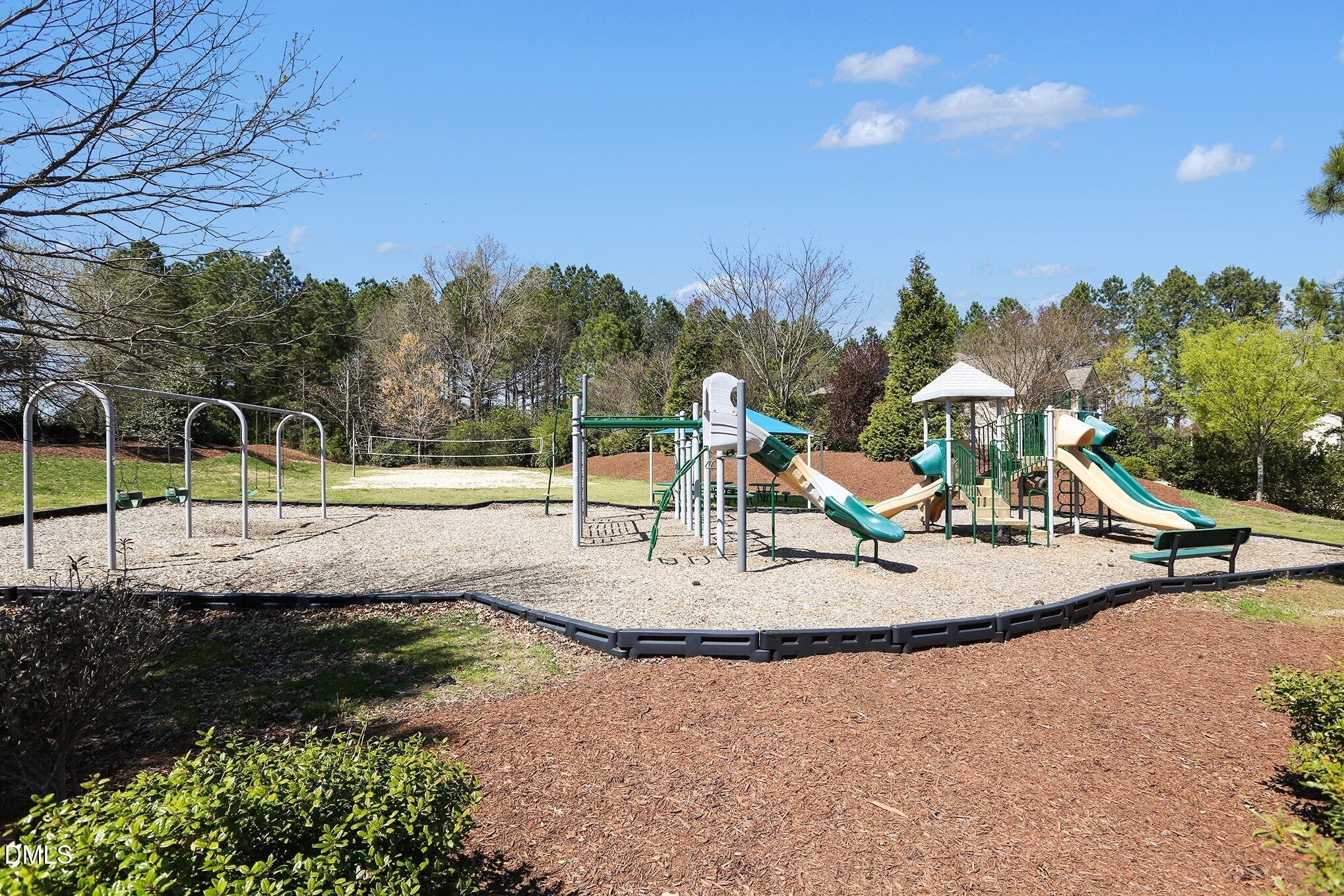 351 Gartrell Way Cary, NC 27519 - Photo 49 of 51 a view of a park with swings and slides