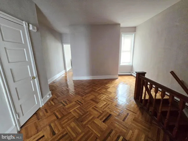 a view of entryway with stairs and wooden floor