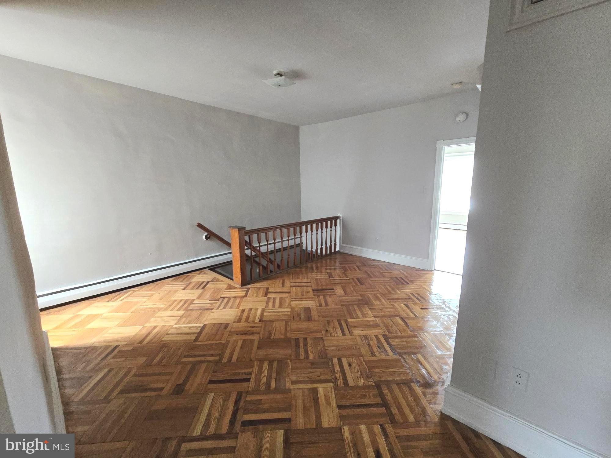 5709 Leonard Street Philadelphia, PA 19149 - Photo 4 of 19 a view of empty room with wooden floor