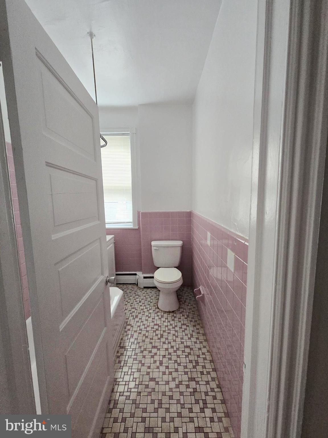 5709 Leonard Street Philadelphia, PA 19149 - Photo 6 of 19 a bathroom with a toilet and a shower