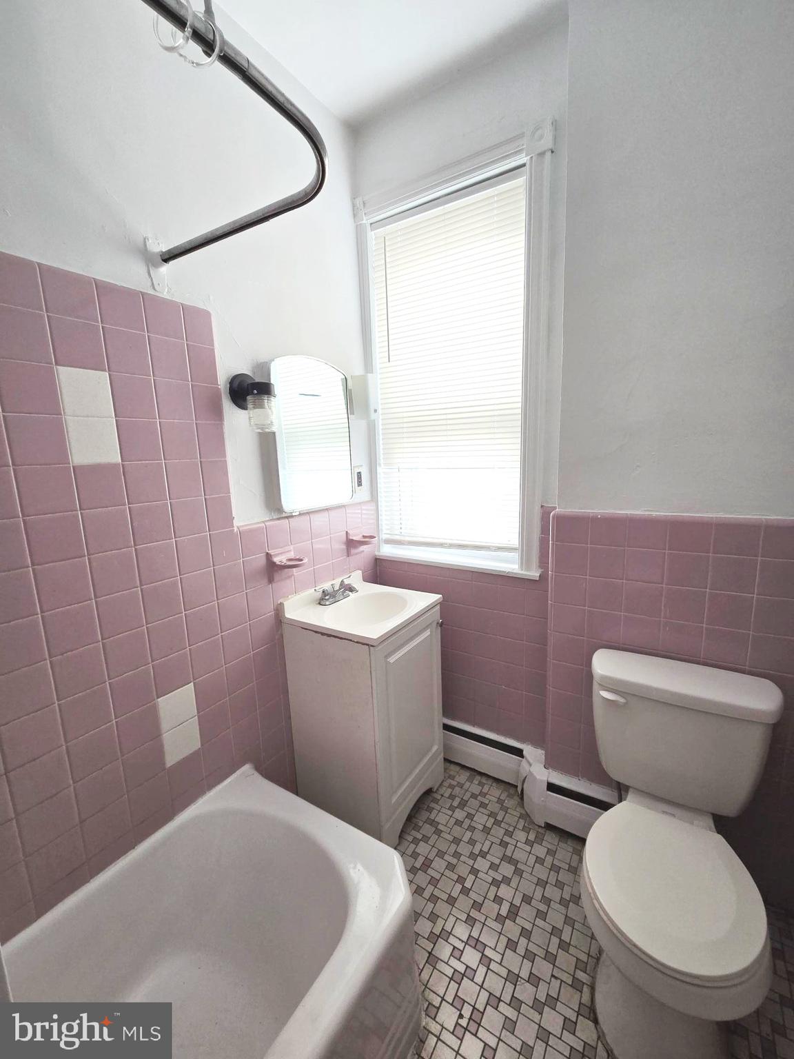 5709 Leonard Street Philadelphia, PA 19149 - Photo 7 of 19 a bathroom with a sink toilet and shower