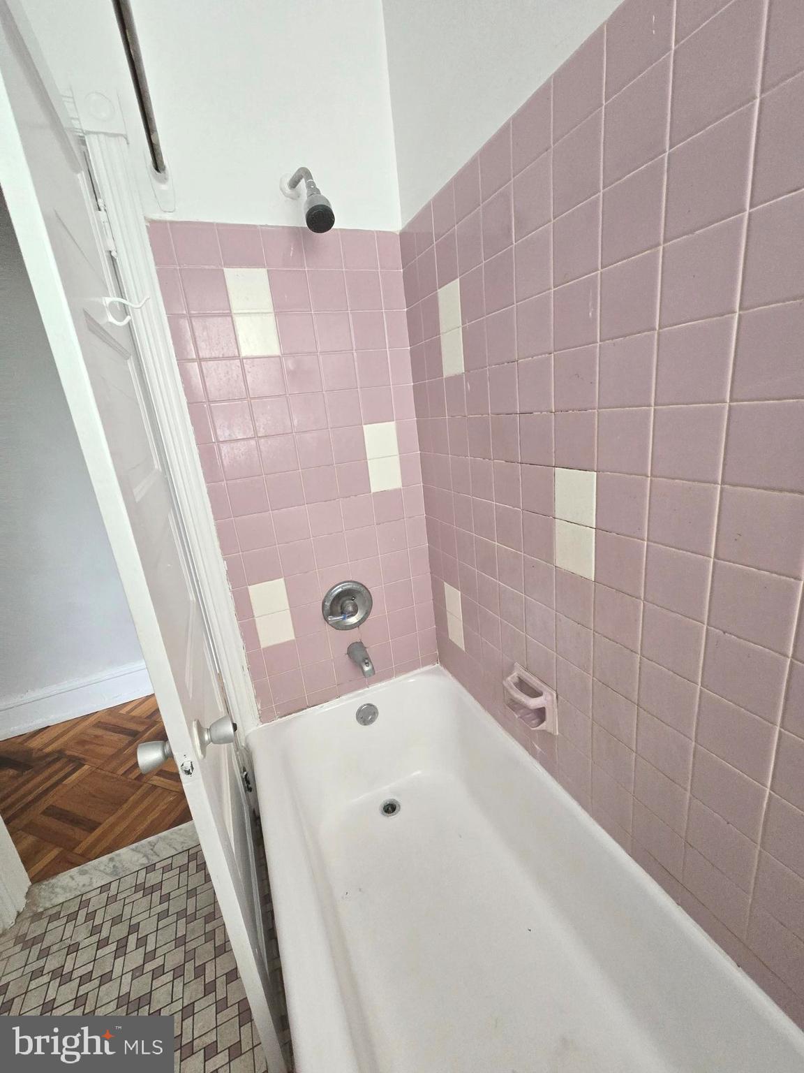 5709 Leonard Street Philadelphia, PA 19149 - Photo 8 of 19 a bathroom with a bathtub and a shower