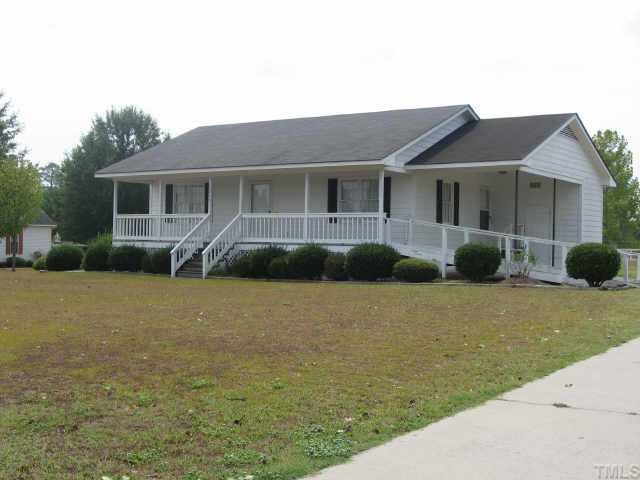 3517 Old Stage Road North Angier, NC 27501 - Photo 1 of 5 a front view of a house with garden