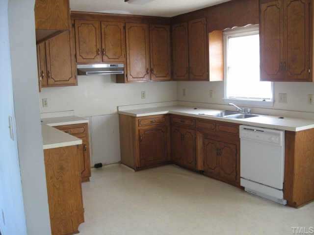 3517 Old Stage Road North Angier, NC 27501 - Photo 2 of 5 a kitchen with a sink a stove and cabinets
