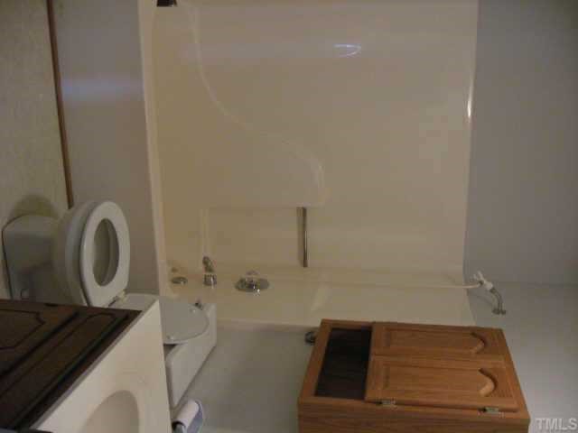 3517 Old Stage Road North Angier, NC 27501 - Photo 3 of 5 a bathroom with a bathtub