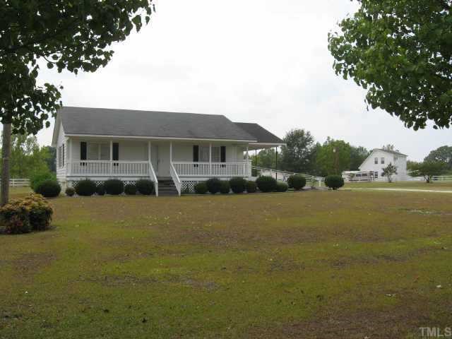 3517 Old Stage Road North Angier, NC 27501 - Photo 5 of 5 a front view of a house with a yard and trees