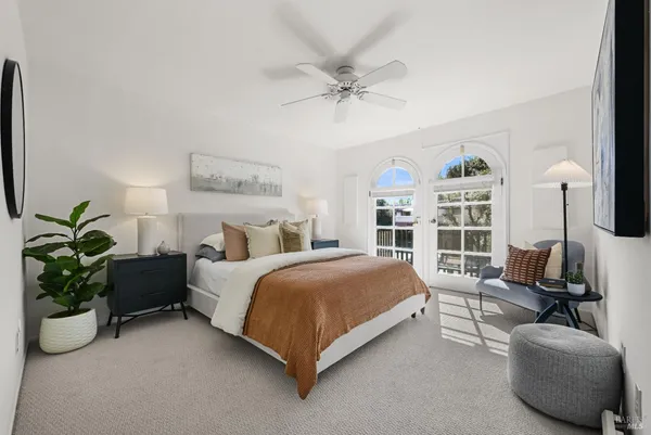 a spacious bedroom with a bed and a couch