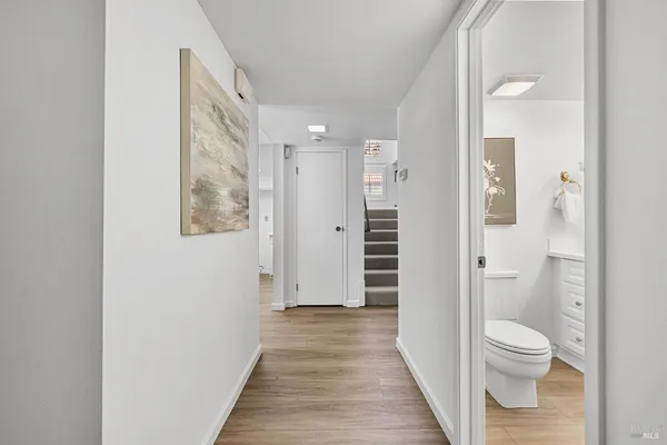 a walk in closet and a bathroom