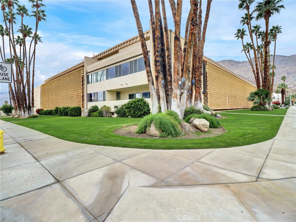 277 East Alejo Road, Unit 214 Palm Springs, CA 92262 - Photo 1 of 17 a view of a house with a garden