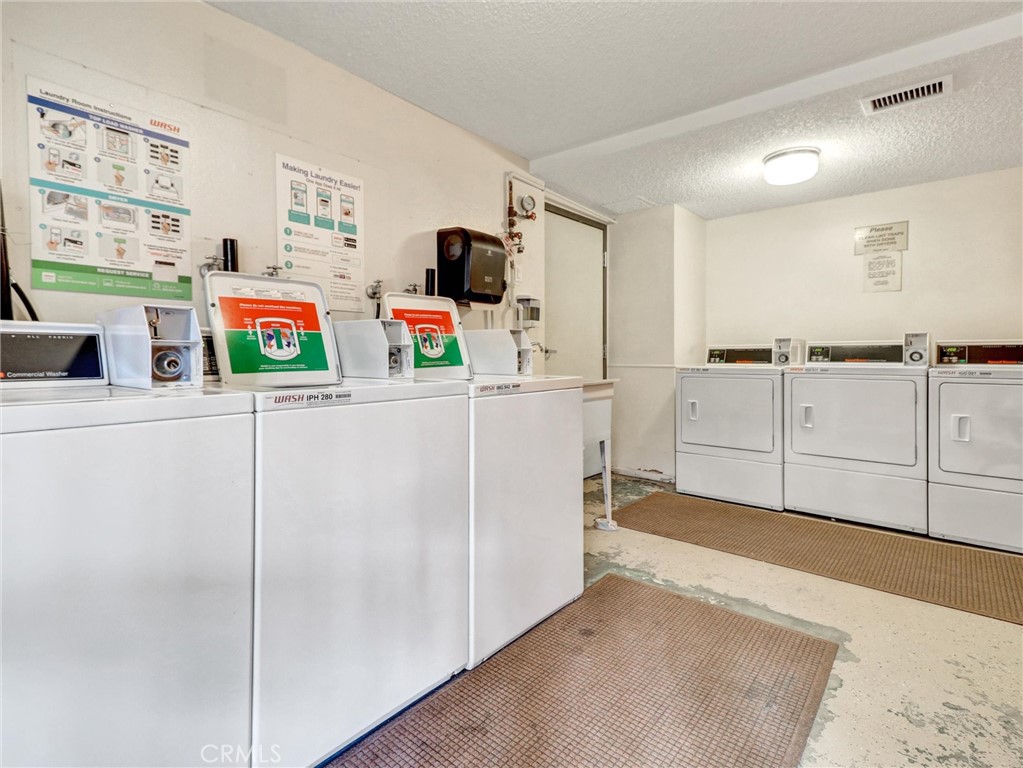 277 East Alejo Road, Unit 214 Palm Springs, CA 92262 - Photo 15 of 17 a room with storage and utility