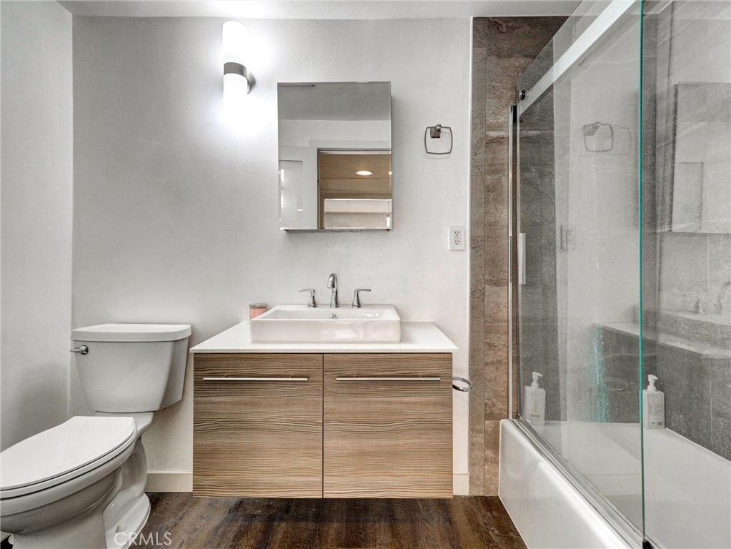 277 East Alejo Road, Unit 214 Palm Springs, CA 92262 - Photo 9 of 17 a bathroom with a sink toilet and shower