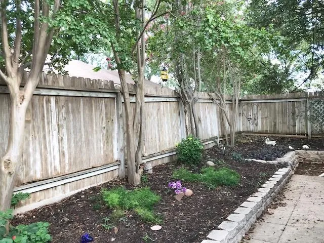 a backyard of a house with lots of green space