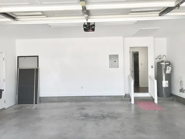 a view of a livingroom with wooden floor and door