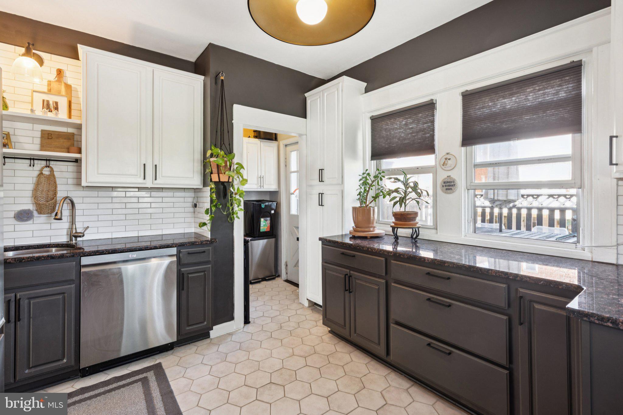 674 Wendover Street Philadelphia, PA 19128 - Photo 16 of 50 Chic kitchen with modern contrasts.