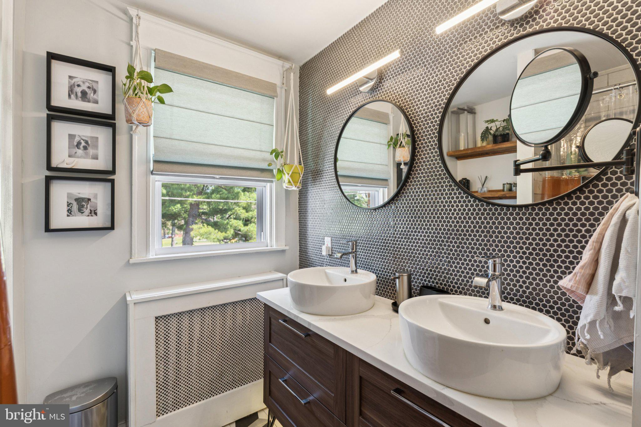 674 Wendover Street Philadelphia, PA 19128 - Photo 29 of 50 Sleek modern bathroom with dual sinks.