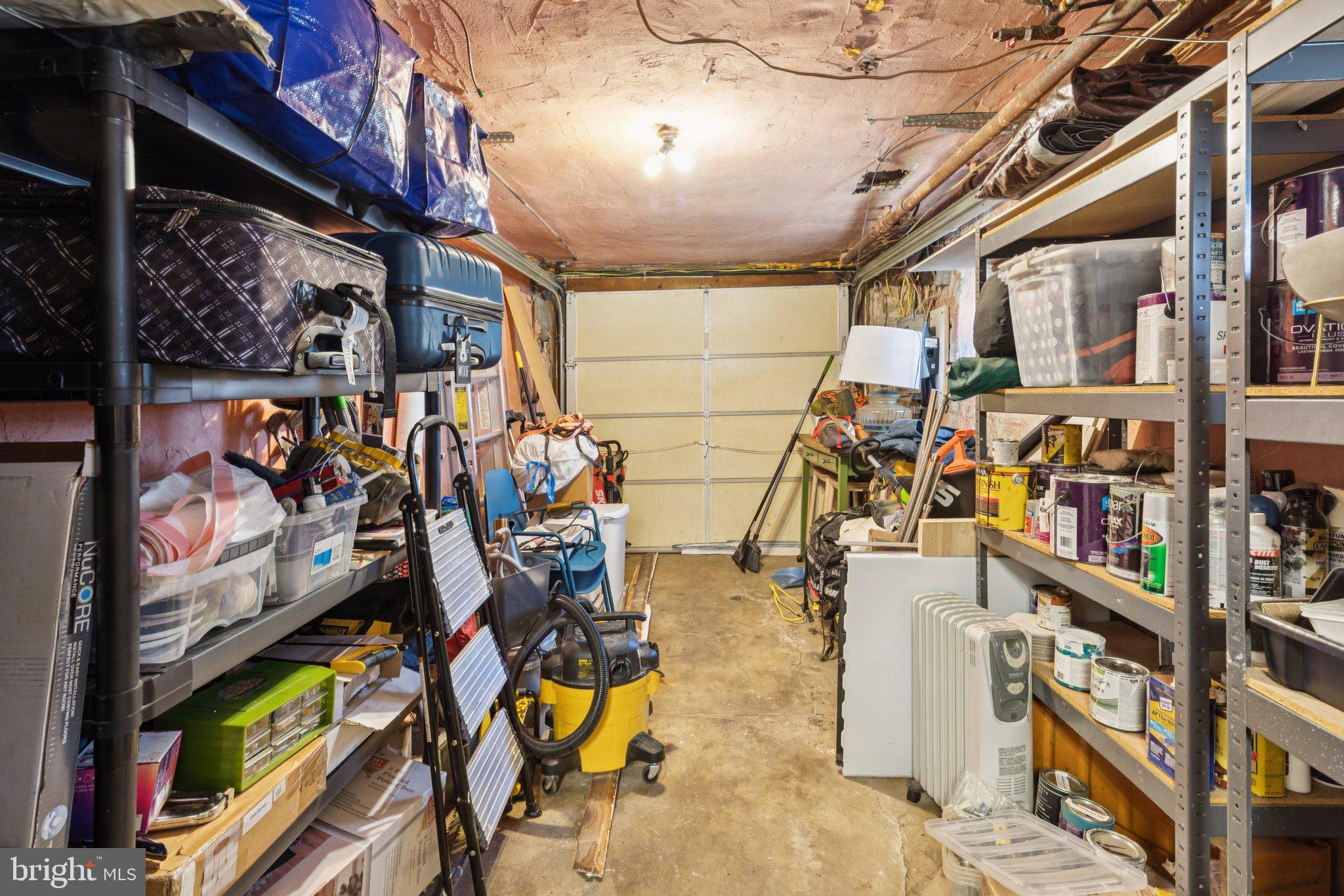 674 Wendover Street Philadelphia, PA 19128 - Photo 39 of 50 Cluttered garage brimming with potential.