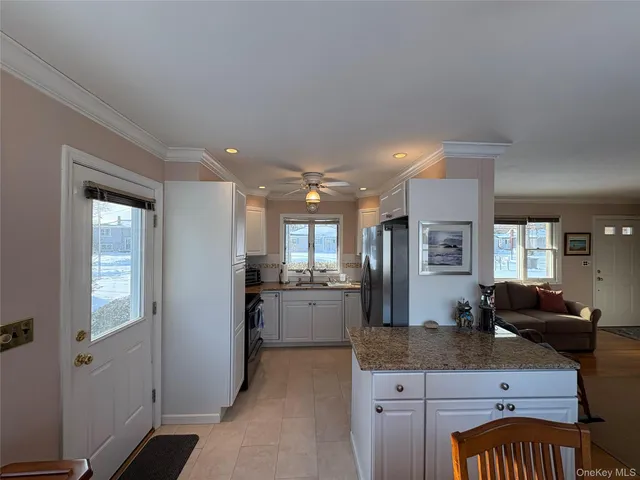 a large bathroom with a granite countertop sink a large mirror and shower