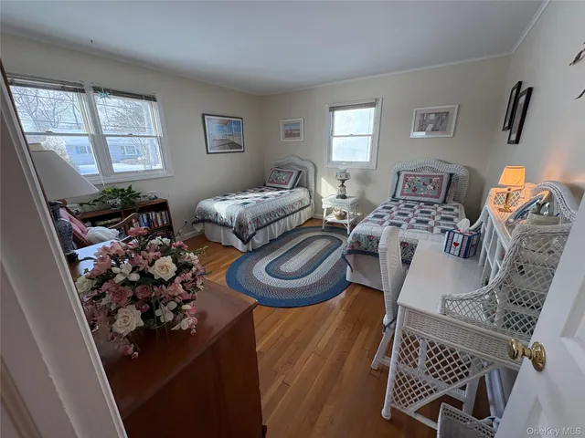 a bedroom with furniture and a window