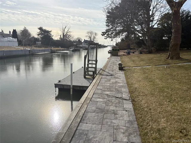 a lake view with a wooden bridge