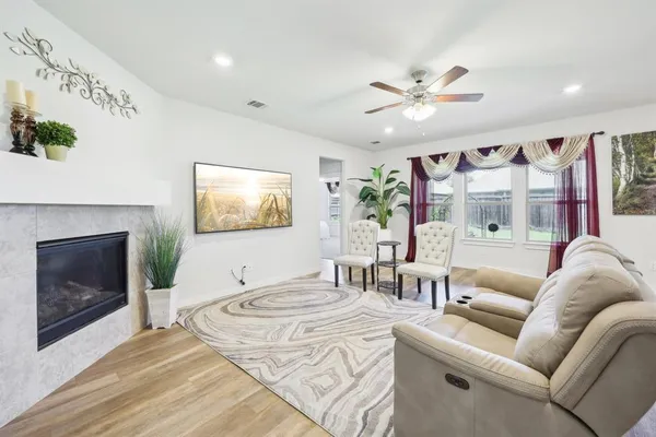 a living room with furniture and a fireplace