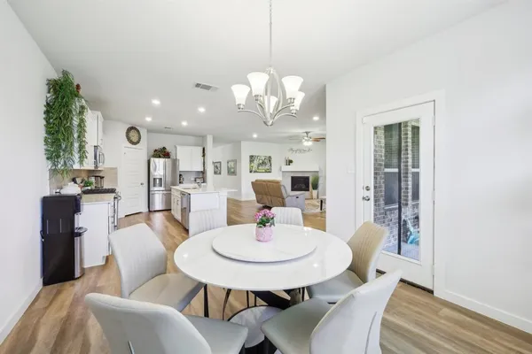 a dining room with furniture and window