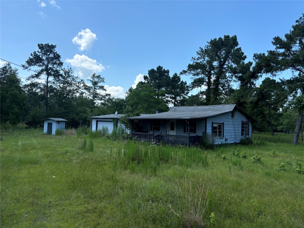 2736 Whitetail Forest Road Kountze, TX 77625 - Photo 4 of 8 a backyard of a house with lots of green space