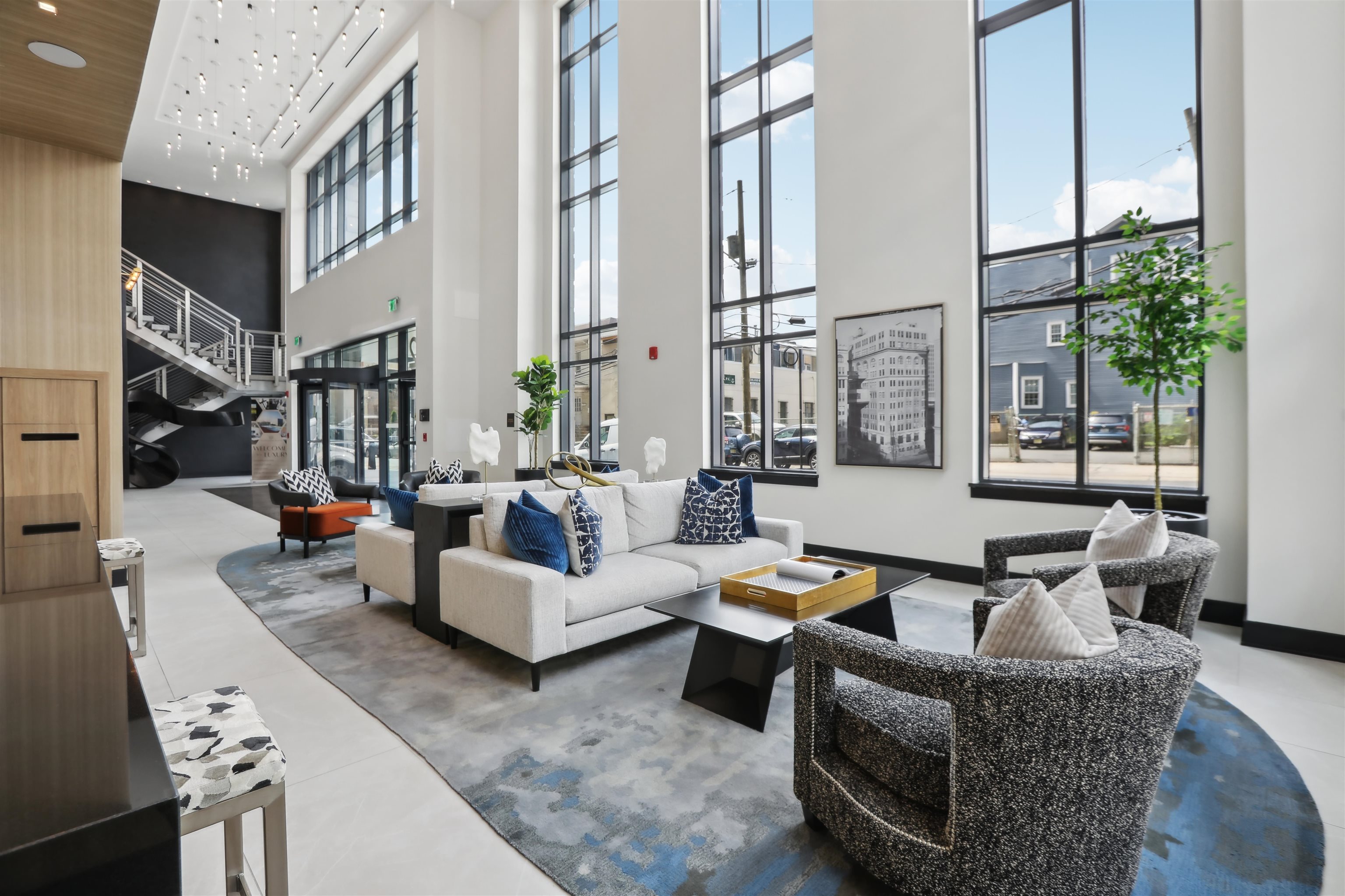 32 Oakland Avenue, Unit 1504 Jersey City, NJ 07306 - Photo 16 of 50 a living room with fireplace furniture and a large window