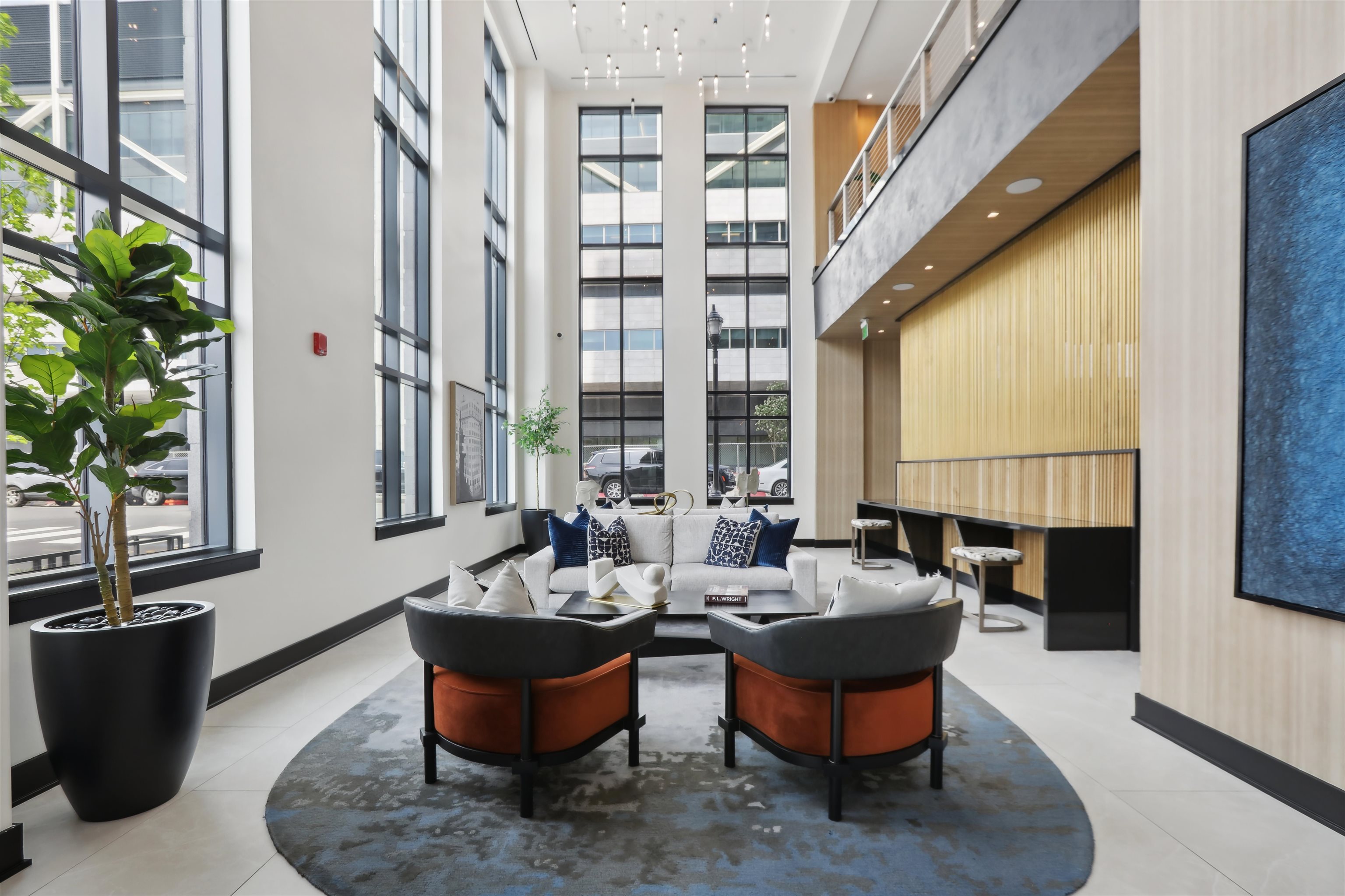 32 Oakland Avenue, Unit 1504 Jersey City, NJ 07306 - Photo 17 of 50 a living room with fireplace furniture and a large window