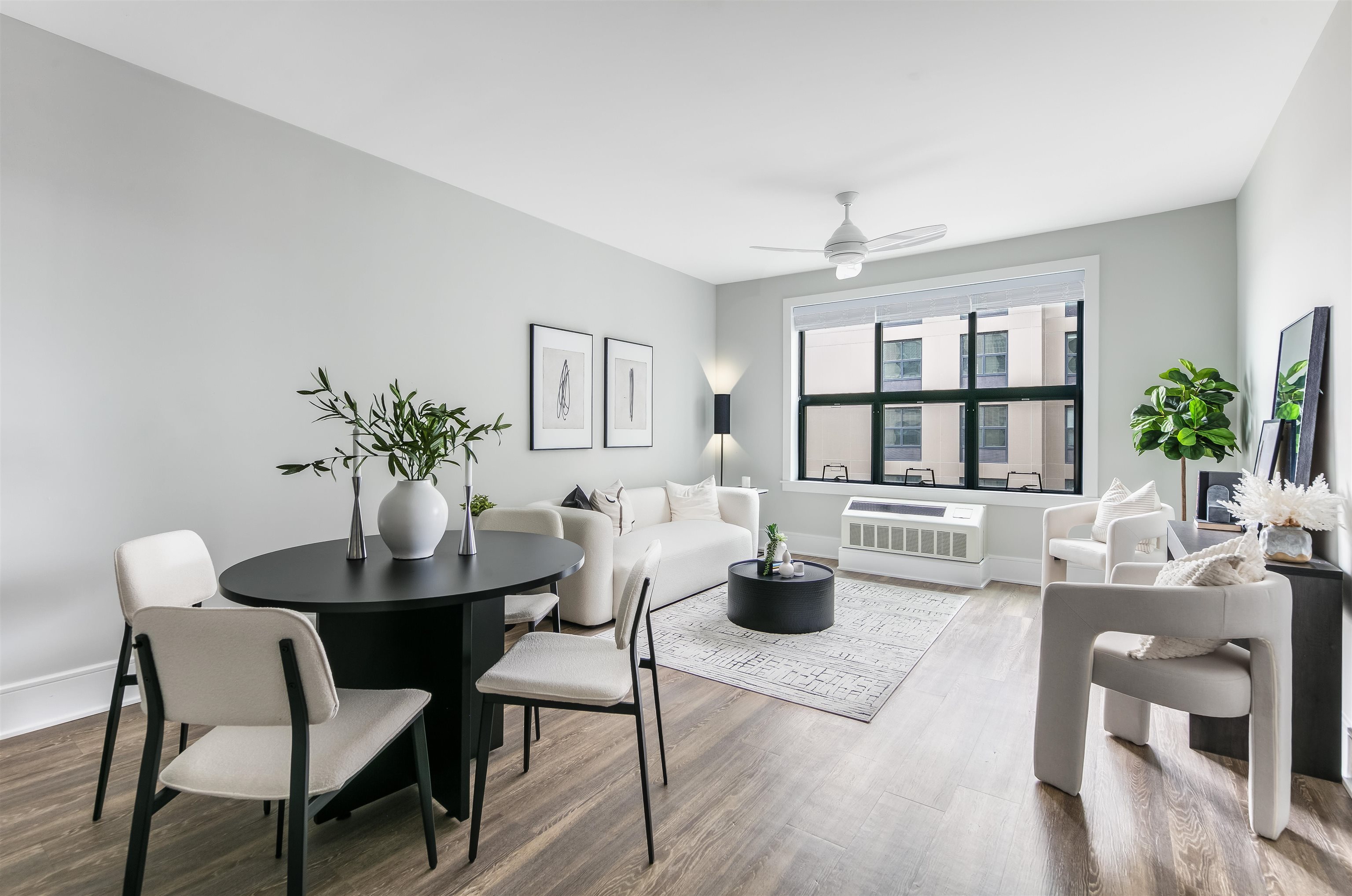 32 Oakland Avenue, Unit 1504 Jersey City, NJ 07306 - Photo 2 of 50 a living room with furniture potted plant and windows