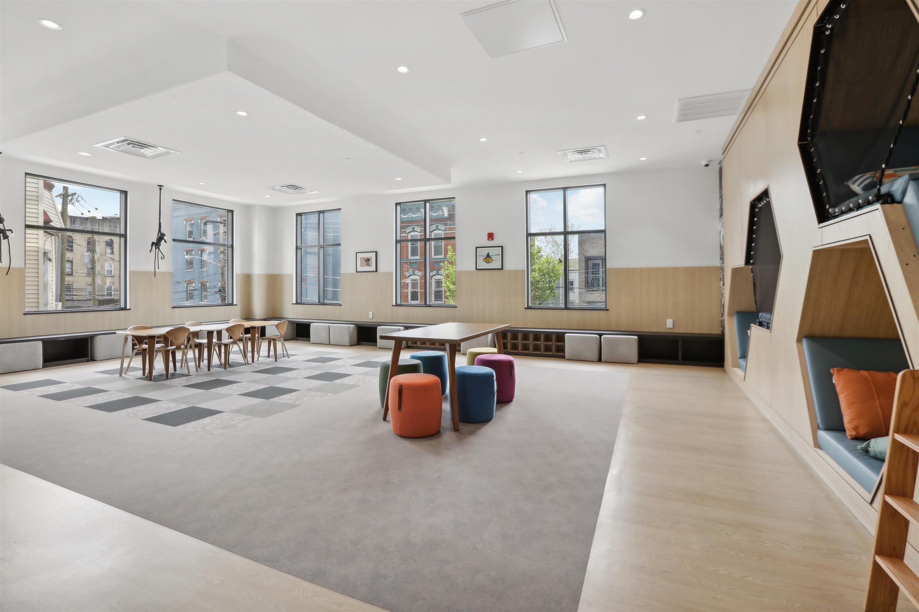 32 Oakland Avenue, Unit 1504 Jersey City, NJ 07306 - Photo 24 of 50 a living room with furniture and flat screen tv