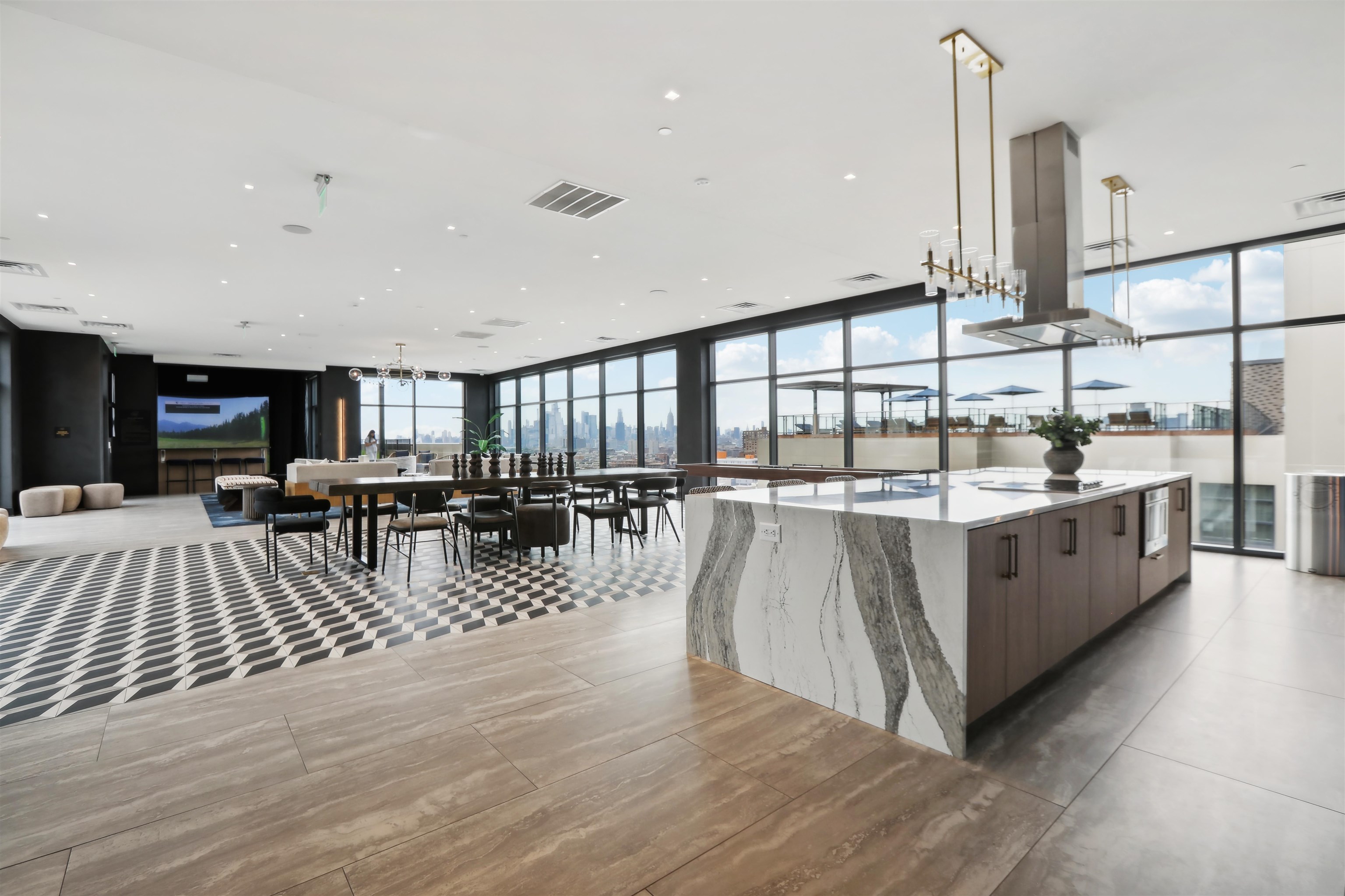 32 Oakland Avenue, Unit 1504 Jersey City, NJ 07306 - Photo 29 of 50 a large white kitchen with lots of counter space a sink and stainless steel appliances