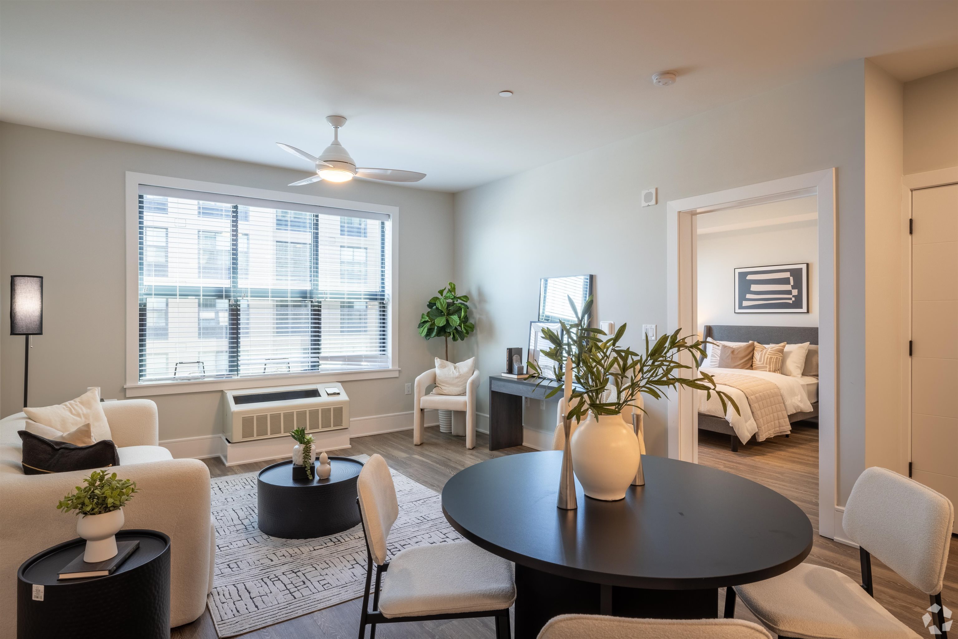 32 Oakland Avenue, Unit 1504 Jersey City, NJ 07306 - Photo 3 of 50 a dining room with furniture a chandelier and wooden floor