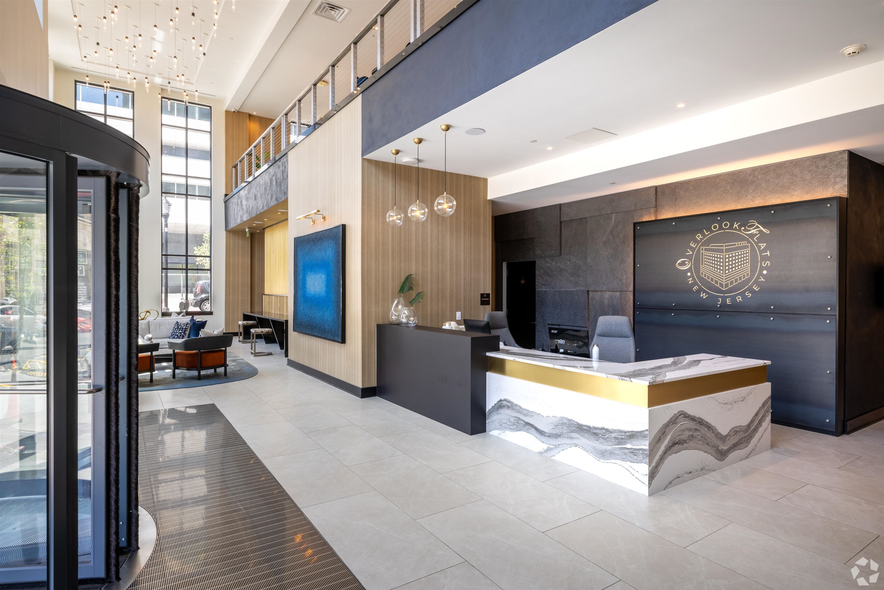 32 Oakland Avenue, Unit 1504 Jersey City, NJ 07306 - Photo 42 of 50 a lobby with furniture and a couch