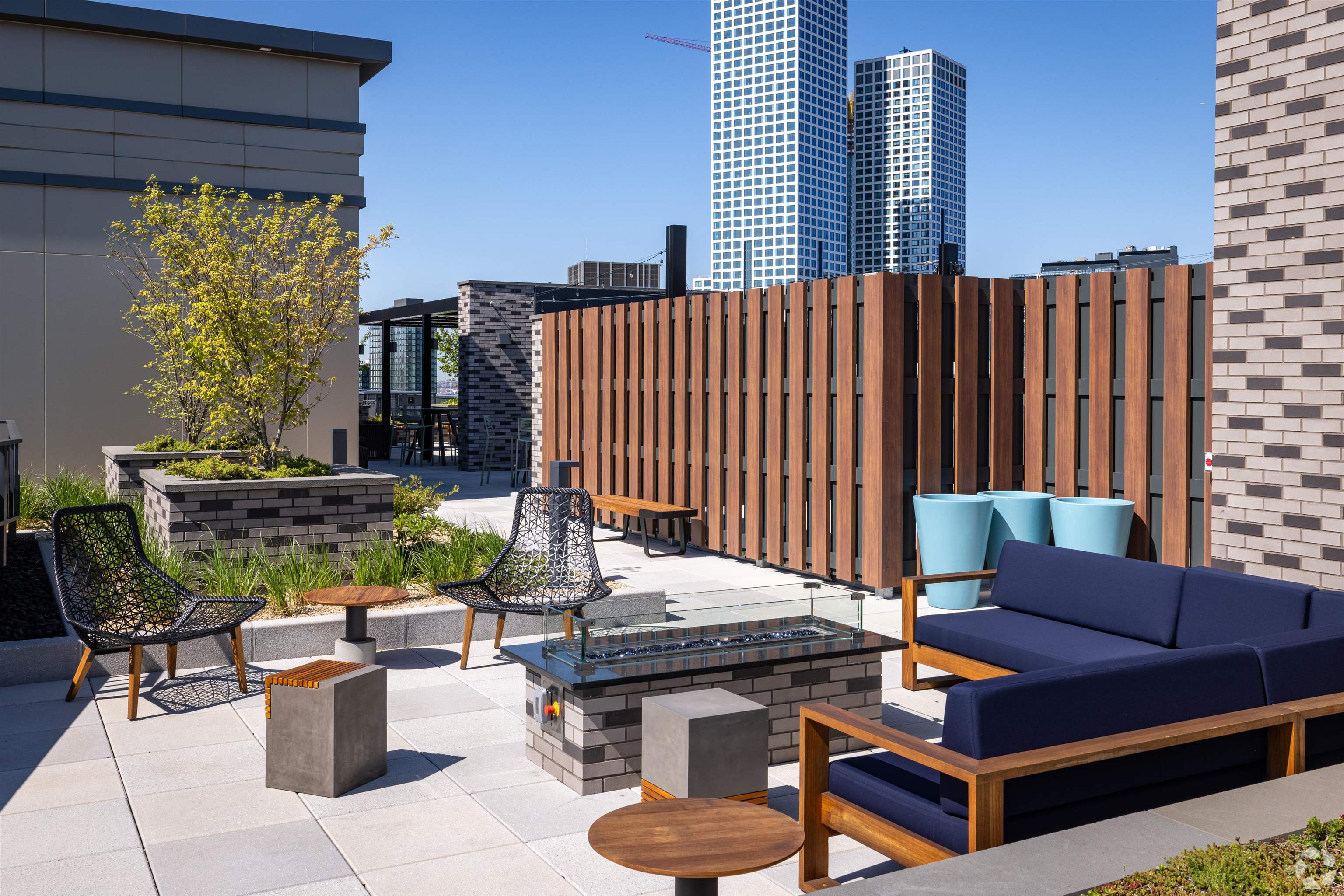 32 Oakland Avenue, Unit 1504 Jersey City, NJ 07306 - Photo 47 of 50 a outdoor living space with furniture and a potted plant