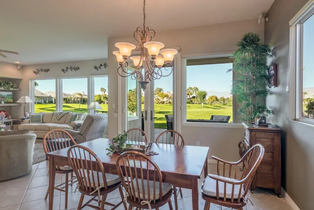 a kitchen with stainless steel appliances granite countertop a refrigerator stove and sink