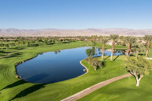 a view of a golf course with a lake