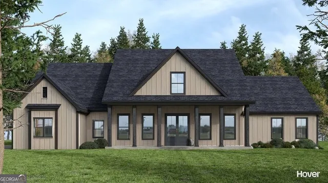 a view of a house with garden and front view