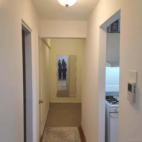a view of a hallway with a room