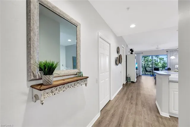 a hallway with a view of living room
