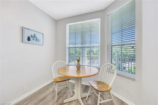 a dining room with furniture and window