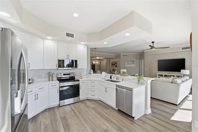 a kitchen with refrigerator and cabinets