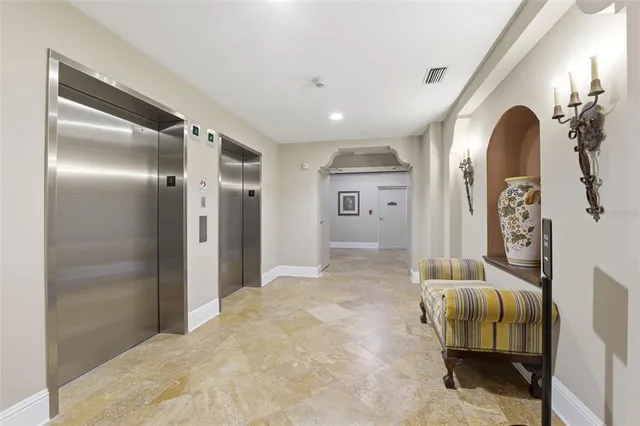 a view of a hallway with wooden shelves