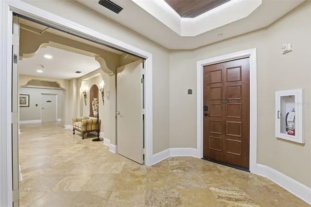 a view of an entryway with wooden floor