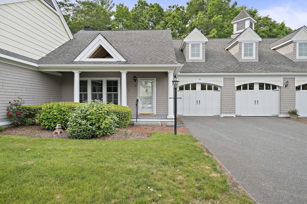 14 Sugar Maple Circle, Unit 14 Hanover, MA 02339 - Photo 1 of 38 a front view of a house with a yard and garage