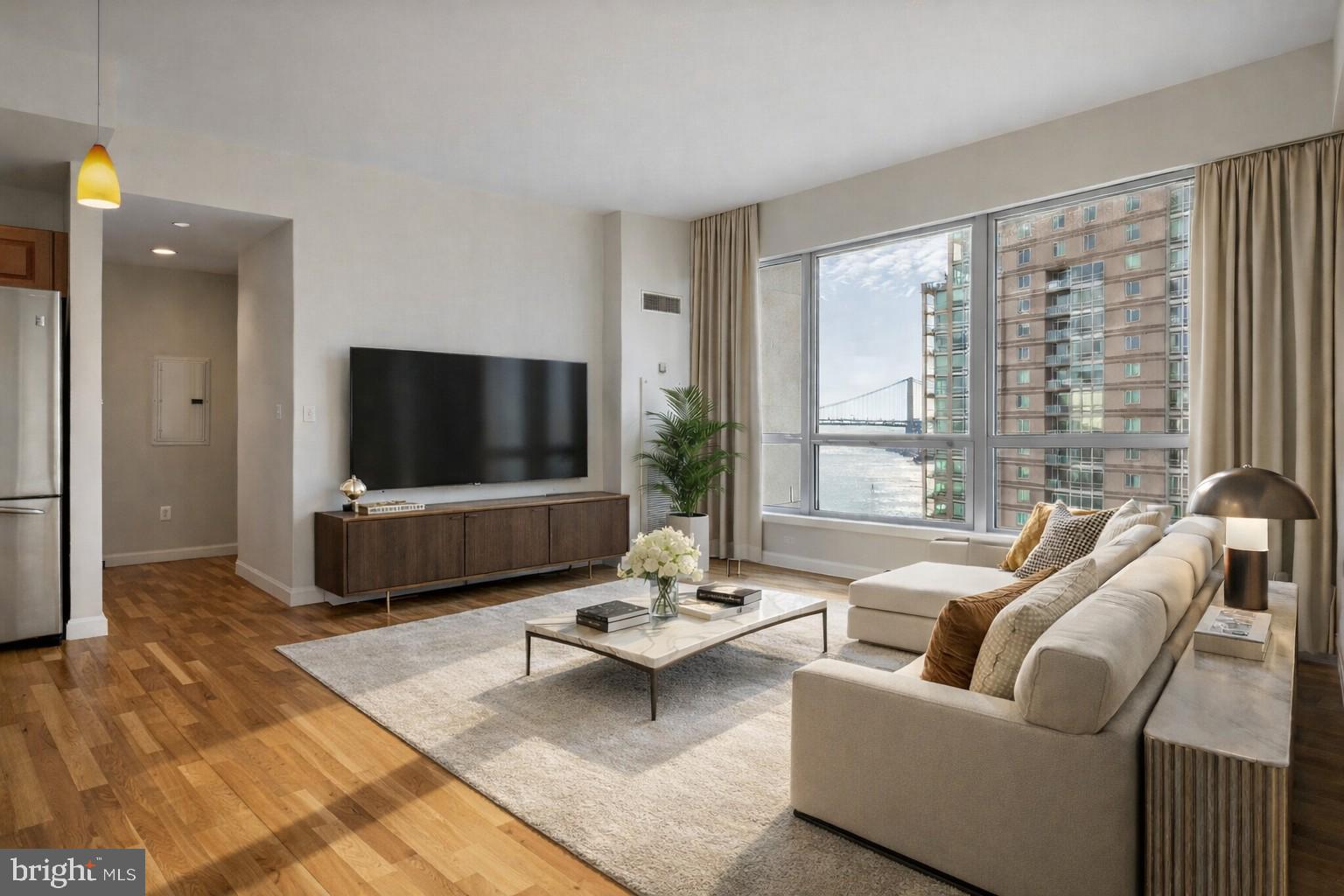 a living room with furniture and a flat screen tv